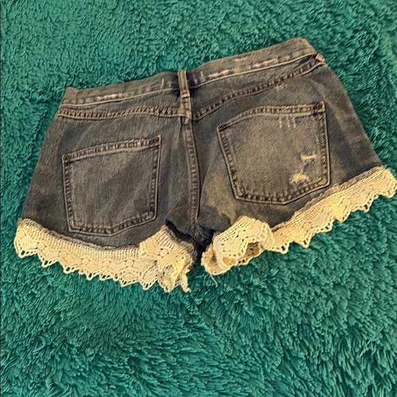 Free People Women’s Cutoff Jean Shorts with Lace Trim - Picture 2 of 6